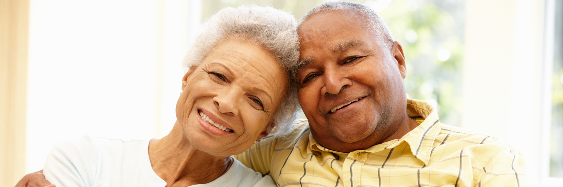 african american couple heads together man in yellow
